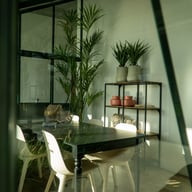 Inside a Janssens Arcadia green lean-to greenhouse