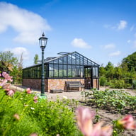 Janssens Gigant Victorian greenhouse in a landscaped garden