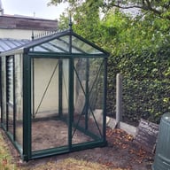 Janssens Helios Urban green greenhouse in a garden