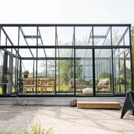 Front view of a Janssens Modern pent roof greenhouse