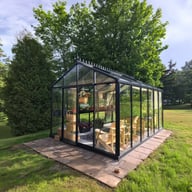 Janssens Senior black greenhouse in a garden
