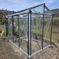 Janssens Urban Hobby silver greenhouse in a garden
