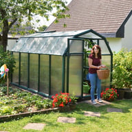 Palram Canopia Eco Grow 6x10 Green greenhouse side lifestyle photograph