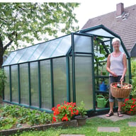 Palram Canopia Eco Grow 6x12 Green greenhouse side lifestyle photograph