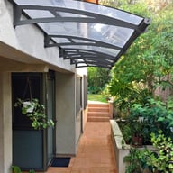 Palram - Canopia Aquila 4100 Door Awning Dark Grey Colour