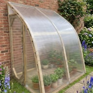 Norhage Lite Vegg 150 lean-to greenhouse with twin-wall polycarbonate glazing against a brick wall