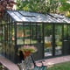 Janssens Helios Retro greenhouse in a garden