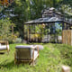 Black Janssens Kathedral orangery greenhouse in a landscaped garden