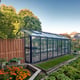 Janssens Master Victorian black greenhouse in a garden