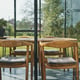 Dining inside a Janssens Modern pent roof greenhouse