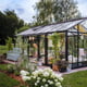Janssens Senior black greenhouse in a landscaped garden