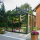 Janssens Senior green greenhouse in a garden