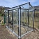 Janssens Urban Hobby silver greenhouse in a garden