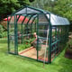 Palram Canopia Grand Gardener 8x16 Green greenhouse front lifestyle photograph
