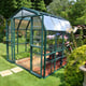 Palram Canopia Grand Gardener 8x8 Green greenhouse side lifestyle photograph