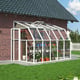 Palram Canopia Sun Room 6x10 White lean-to greenhouse official lifestyle photograph