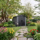 Lifetime 7x7 Plastic Shed with Windows Garden Angle View