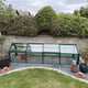 Elite Min E Lite Cold Frame in green on a garden patio