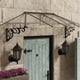 Lily 2600 Black Clear Door Canopy in a garden setting