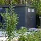 Telluria metal garden shed installed in a garden