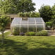 Norhage Tre 300 wooden greenhouse in a garden