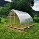 Norhage Tre 300 greenhouse installed in a garden
