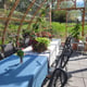 Norhage Tre 300 wooden polycarbonate greenhouse interior arranged for a dining event