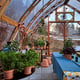 Norhage Tre 300 wooden polycarbonate greenhouse winter garden interior with potted plants
