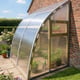 Gable end of the Norhage Lite Vegg 150 lean-to greenhouse showing the curved roof and opening window