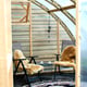 Seating area inside the Norhage Vegg 300 lean-to greenhouse