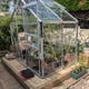 Vitavia Venus greenhouse installed on a timber plinth base instead of a steel base
