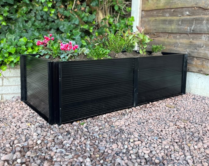 Elite Roots and Shoots 2x4 Raised Bed shown with optional black powder-coated finish